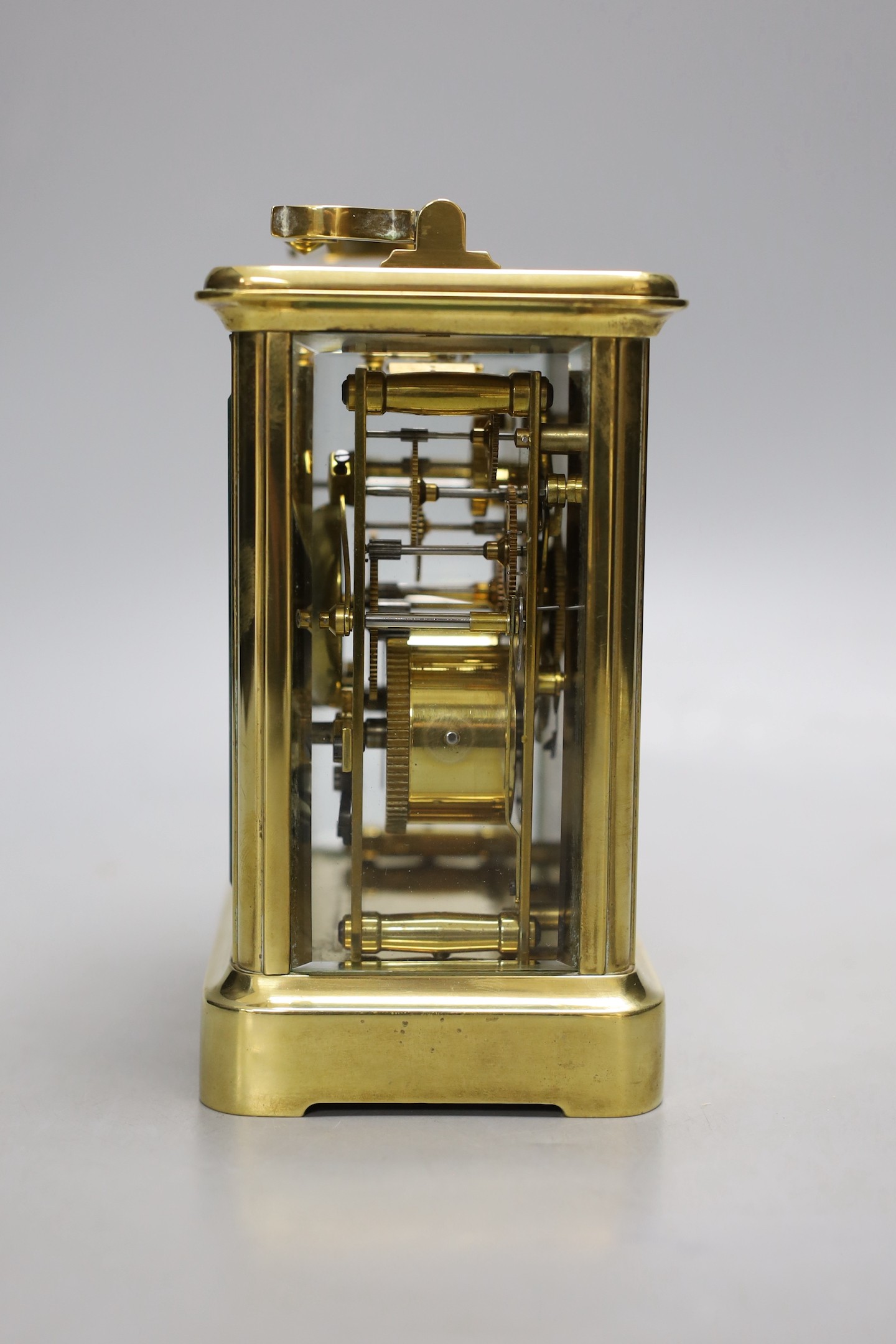 A large brass carriage clock, retail by Charles Frodsham, 14.5 cms high.